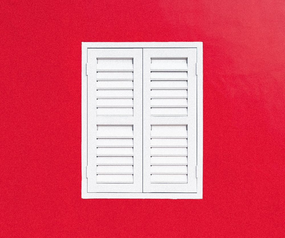 red wall and a window
